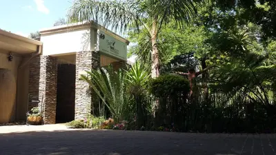 a building with a sign on the side of it at Eagle Rock Executive Guest House in Kempton Park