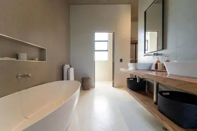 a bathroom with two sinks and a large tub at Shira Lodge Africa