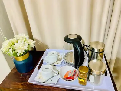 a tray with a coffee maker on a table at Siena Sun Celebration House Party friendly noise tolerant in Midrand