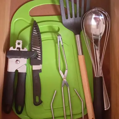 a green cutting board with utensils on it at 6 on First Self catering in Pretoria