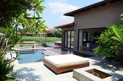 a backyard with a pool and a house at Luxury Stay at The 28 Pecanwood in Hartbeespoort