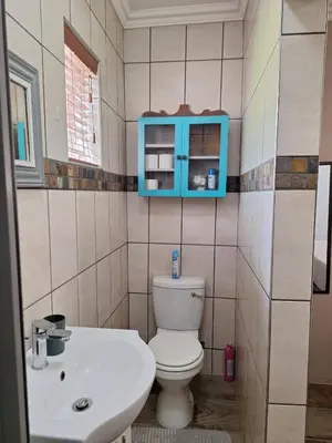 a bathroom with a toilet and a sink at 270 Foutains Avenue, Centurion, Lyttelton Manor in Centurion