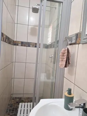 a bathroom with a shower and a white sink at 270 Foutains Avenue, Centurion, Lyttelton Manor in Centurion
