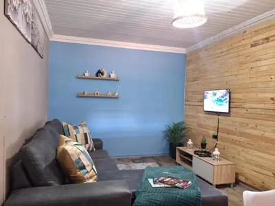 a living room with blue walls and a couch at 270 Foutains Avenue, Centurion, Lyttelton Manor in Centurion