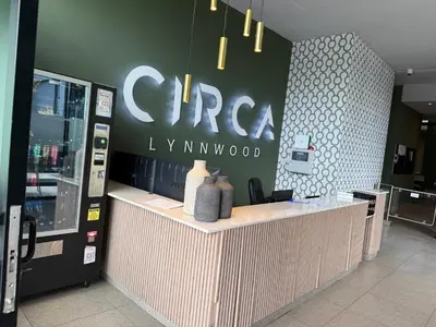 a coffee shop with a sign on the wall at CIRCA Lynwood Air B&B in Pretoria
