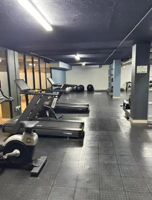a gym with several treadmills and cardio machines at CIRCA Lynwood Air B&B in Pretoria