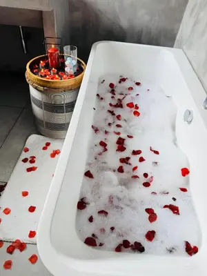 a white bath tub filled with blood in a bathroom at Bras boutique in Steelpoort
