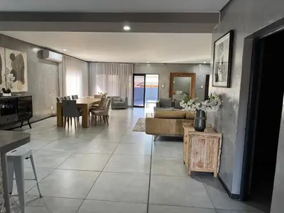 a living room with a couch and a table at Bras boutique in Steelpoort