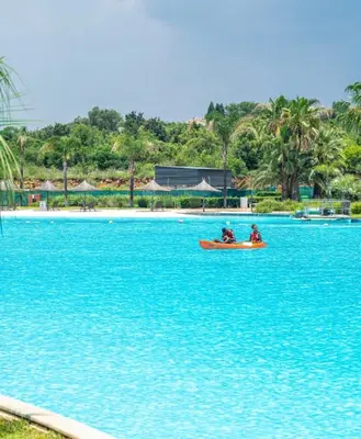 two people in a boat in a body of water at The Blyde Crystal Lagoon Pretoria in Pretoria