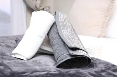 two rolls of toilet paper sitting on a bed at Lethabo Guesthouse