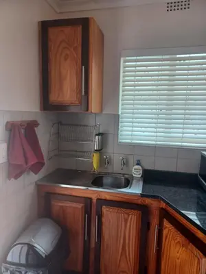 a kitchen with a sink and a window at The Roaches in White River