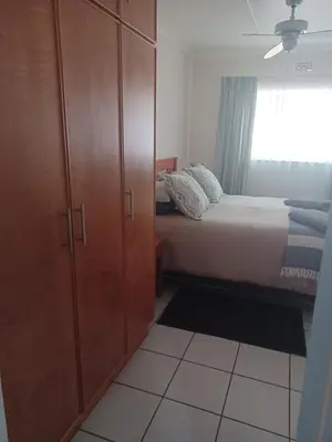 a bedroom with a bed and a cabinet and a window at The Roaches in White River