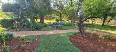 a park with a picnic table in the grass at Jireh in Pretoria