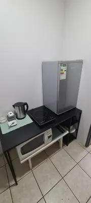 a microwave sitting on a table in a kitchen at Jireh in Pretoria