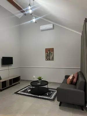 a living room with a couch and a table at Pendleberry Grove 33 in Bela-Bela