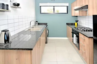 a kitchen with a sink and a counter top at Safubi 2 bedroom apartment in Nelspruit