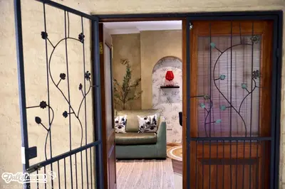 a door leading into a living room with a couch at Olive & Ivy Cherry Grove 7 in Dullstroom