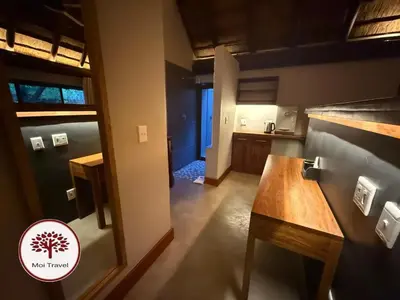 a kitchen with a wooden counter top in a room at Zebula - Bushveld Waters - 20 Pax in Warmbaths