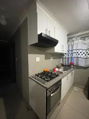 a kitchen with a stove and a counter top at Mbombela Stay in Nelspruit