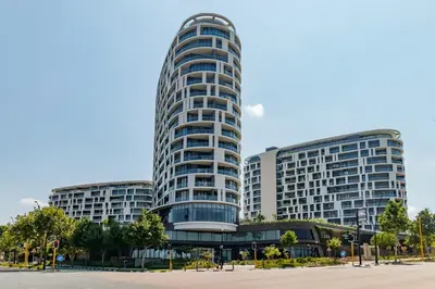 two tall buildings in a city at Ellipse Waterfall - Luxe Urban Escape in Midrand