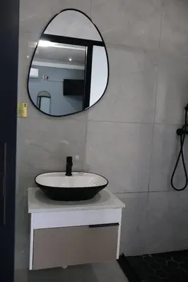 a bathroom with a sink and a mirror at De Rams boutique guest house