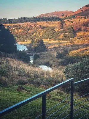 a view of a river in a field at Walkerson Estate Country Home in Dullstroom