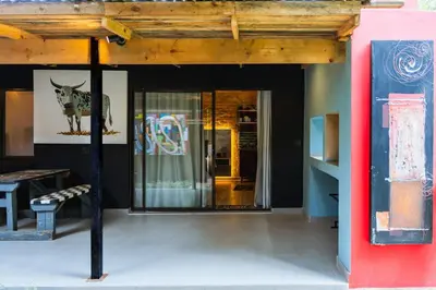 a entrance to a building with a glass door at Gillford Alley luxury bachelor living in Benoni
