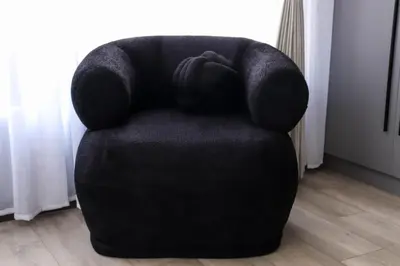 a black chair with a person laying on it at Bayley Boutique Guesthouse & Hydro Spa in Benoni