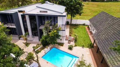 an aerial view of a house with a swimming pool at Bayley Boutique Guesthouse & Hydro Spa in Benoni