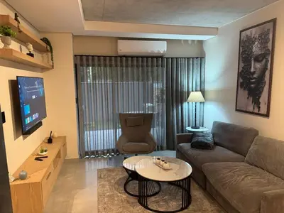 a living room with a couch and a table at Waterkloof Park in Pretoria