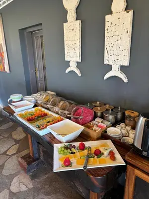 a table with a bunch of food on it at Mohlabetsi Safari Lodge in Hoedspruit