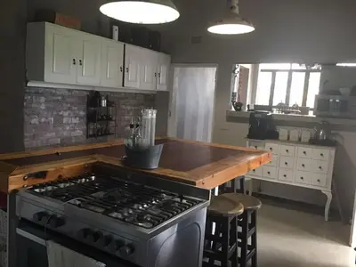 a kitchen with a stove and a counter top at Hooggelegen Estate in White River