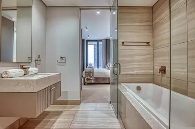 a bathroom with a tub and a sink and a shower at Stormside at Ellipse in Midrand