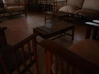 a living room with a couch and a table at Awelani Eco Tourism Lodge in Masisi