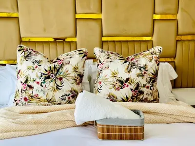 a bed with two pillows on top of it at Cosy stay at The Blyde With Lagoon in Pretoria