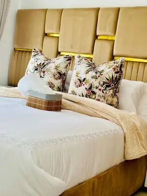 a bed with two pillows on top of it at Cosy stay at The Blyde With Lagoon in Pretoria