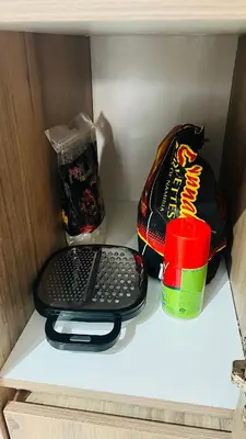 a shelf in a refrigerator with a bag of chips and a keyboard at Cosy stay at The Blyde With Lagoon in Pretoria