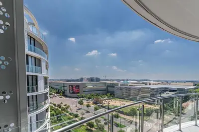 a view from the balcony of a building at Ellipse Manscave Modern Luxury Apartment in Midrand