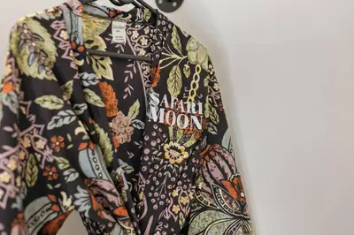 a hawaiian moon shirt hanging on a wall at Bushveld Villa w Pool, Firepit & Outdoor Living in Hoedspruit