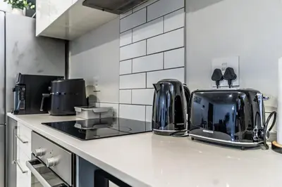 a kitchen with a toaster on a counter at Menlo Park Luxury Free Parking King bed Workstation 3 km to Menlyn Maine in Pretoria