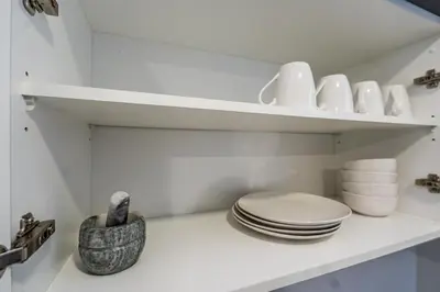 a white bathroom with a toilet on a shelf at Menlo Park Luxury Free Parking King bed Workstation 3 km to Menlyn Maine in Pretoria