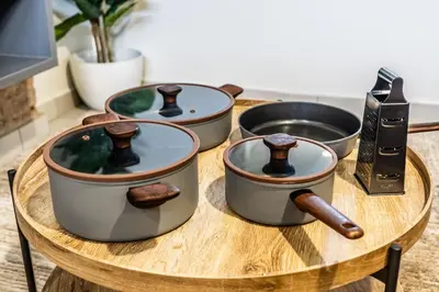 a group of four pots on a wooden table at Menlo Park Luxury Free Parking King bed Workstation 3 km to Menlyn Maine in Pretoria