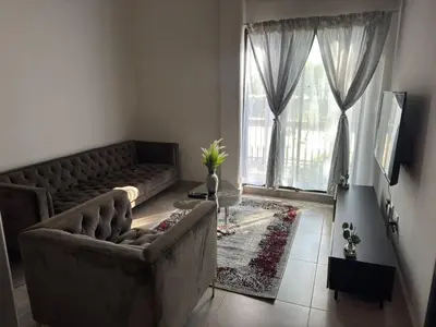 a living room with a couch and a large window at Circa apartment unit 42 in Pretoria