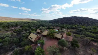 an aerial view of a house in the middle of a forest at Tholo Bush Stay