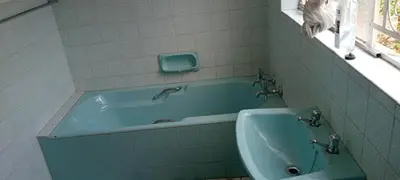 a bathroom with a tub and a sink at Villa paradiso in Centurion