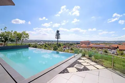 a swimming pool on the roof of a house at 1 Thango Executives Ellipse Gallileo in Midrand