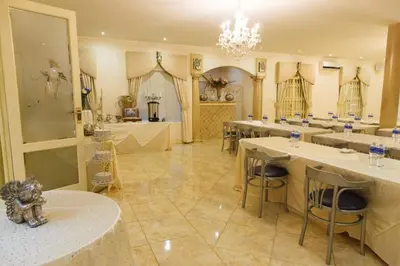a large room with tables and chairs and a chandelier at Angels Place Boutique Guesthouse in Pretoria