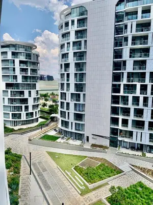 a view of two tall buildings in a city at Awesome Apartment in Ellipse Waterfall Cassini in Midrand