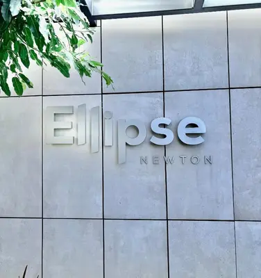 a sign on the side of a building at Stunning Apartment in Ellipse Waterfall Midrand in Midrand