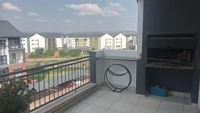 a balcony with a view of a city at 2 Bedroom Penthouse at The Blyde in Pretoria